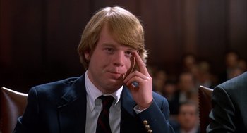 Movie still from “Scent of a Woman” (1992), directed by Martin Brest – A man in a suit talking on a cell phone; Close Up shot, Low angle