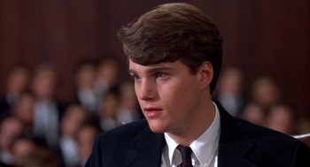 Movie still from “Scent of a Woman” (1992), directed by Martin Brest – A man in a suit and tie looking to his left; Close Up shot, High angle
