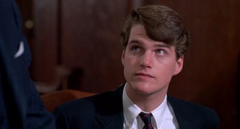 Movie still from “Scent of a Woman” (1992), directed by Martin Brest – A man in a suit and tie looking to his left; Close Up shot, High angle