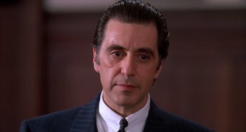 Movie still from “Scent of a Woman” (1992), directed by Martin Brest – A person wearing a suit and tie; Close Up shot, Low angle