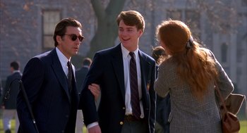 Movie still from “Scent of a Woman” (1992), directed by Martin Brest – Two men and a woman talking to each other outside; Medium shot, Over the shoulder angle