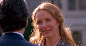 Movie still from “Scent of a Woman” (1992), directed by Martin Brest – A person with long blonde hair; Close Up shot, Over the shoulder angle