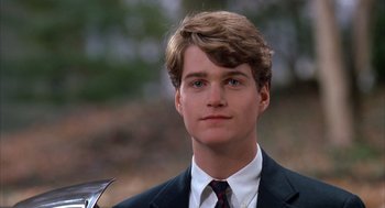 Movie still from “Scent of a Woman” (1992), directed by Martin Brest – A young man in a suit and tie; Close Up shot, Low angle