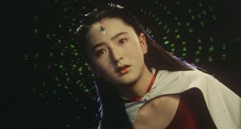 Movie still from “School in the Crosshairs” (1981), directed by Nobuhiko Ôbayashi – A young woman with a star on her forehead; Close Up shot, Low angle