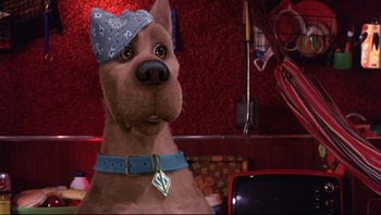 Movie still from “Scooby-Doo” (2002), directed by Raja Gosnell – A brown dog wearing a blue bandanna on its head; Close Up shot, High angle