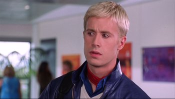 Movie still from “Scooby-Doo” (2002), directed by Raja Gosnell – A man with blonde hair is looking at the camera; Close Up shot, Low angle