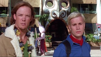 Movie still from “Scooby-Doo” (2002), directed by Raja Gosnell – Two people standing in front of a building with a mask on; Close Up shot, Low angle
