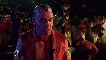Movie still from “Scooby-Doo” (2002), directed by Raja Gosnell – A man in a red jacket with a face tattoo; Close Up shot, Low angle
