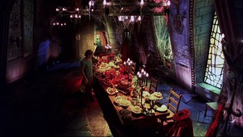 Movie still from “Scooby-Doo” (2002), directed by Raja Gosnell – A table filled with lots of plates of food; Wide shot, High angle