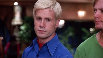 Movie still from “Scooby-Doo” (2002), directed by Raja Gosnell – A man with blonde hair wearing a blue shirt; Close Up shot, Low angle