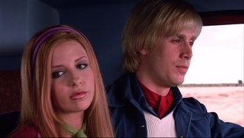 Movie still from “Scooby-Doo” (2002), directed by Raja Gosnell – A man and a woman sitting next to each other in a car; Close Up shot, Low angle