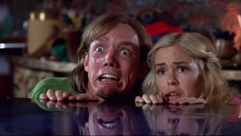 Movie still from “Scooby-Doo” (2002), directed by Raja Gosnell – A man and a woman looking at the camera with their mouths wide open; Close Up shot, Low angle