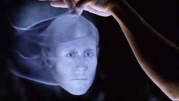 Movie still from “Scooby-Doo” (2002), directed by Raja Gosnell – A person is holding something in front of him; Close Up shot, High angle