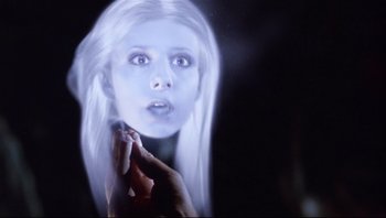 Movie still from “Scooby-Doo” (2002), directed by Raja Gosnell – A woman is looking at her reflection in a mirror; Close Up shot, Over the shoulder angle