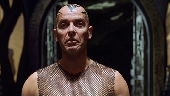 Movie still from “Scooby-Doo” (2002), directed by Raja Gosnell – A bald man with a shaved head and a tattoo on his head; Close Up shot, Low angle