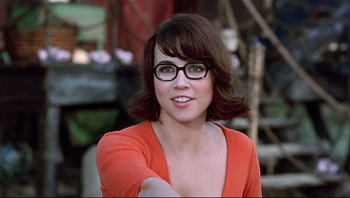 Movie still from “Scooby-Doo” (2002), directed by Raja Gosnell – A person wearing glasses and smiling; Close Up shot, Over the shoulder angle