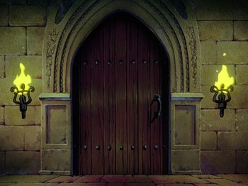 Movie still from “Scooby-Doo on Zombie Island” (1998), directed by Jim Stenstrum – An arched doorway in a castle style building; Wide shot, Low angle