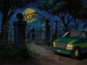 Movie still from “Scooby-Doo on Zombie Island” (1998), directed by Jim Stenstrum – A car parked in front of a cemetery at night; Wide shot, High angle