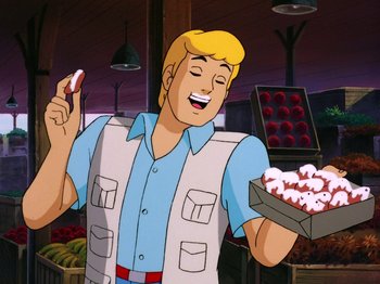 Movie still from “Scooby-Doo on Zombie Island” (1998), directed by Jim Stenstrum – A man holding a box of food in a store; Medium shot, Over the shoulder angle