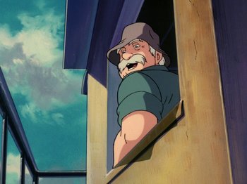 Movie still from “Scooby-Doo on Zombie Island” (1998), directed by Jim Stenstrum – An old man with a hat looking out of a window; Medium shot, Low angle