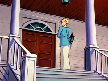 Movie still from “Scooby-Doo on Zombie Island” (1998), directed by Jim Stenstrum – A woman standing on the steps of a house; Wide shot, Low angle
