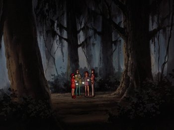 Movie still from “Scooby-Doo on Zombie Island” (1998), directed by Jim Stenstrum – A group of people standing in the middle of a forest; Extreme Wide shot, Low angle