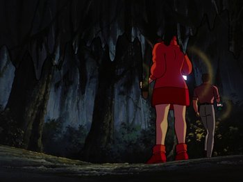 Movie still from “Scooby-Doo on Zombie Island” (1998), directed by Jim Stenstrum – A woman in a short red dress standing next to a man; Wide shot, Low angle