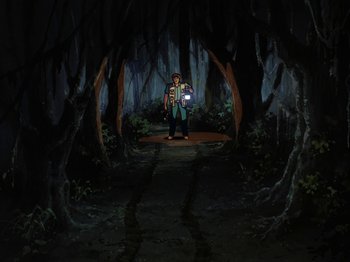 Movie still from “Scooby-Doo on Zombie Island” (1998), directed by Jim Stenstrum – A man standing in the middle of a dark forest; Extreme Wide shot, High angle