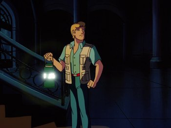 Movie still from “Scooby-Doo on Zombie Island” (1998), directed by Jim Stenstrum – A man holding a flashlight while standing next to a staircase; Medium shot, Low angle