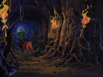 Movie still from “Scooby-Doo on Zombie Island” (1998), directed by Jim Stenstrum – A painting of a man riding a horse through a cave; Wide shot, High angle