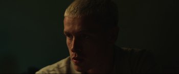 Movie still from “Scrapper” (2023), directed by Charlotte Regan – A person with a white hair; Close Up shot, Low angle