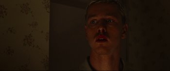 Movie still from “Scrapper” (2023), directed by Charlotte Regan – A person looking at the camera; Close Up shot, Low angle