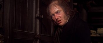 Movie still from “Scrooge” (1970), directed by Ronald Neame – A person with long hair; Close Up shot, Over the shoulder angle