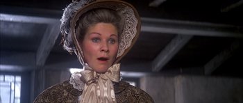 Movie still from “Scrooge” (1970), directed by Ronald Neame – A person wearing a hat; Close Up shot, Over the shoulder angle