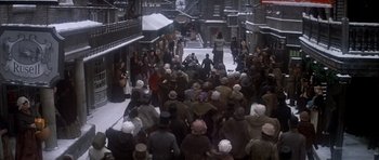 Movie still from “Scrooge” (1970), directed by Ronald Neame – A crowd of people standing in the snow; Extreme Wide shot, High angle