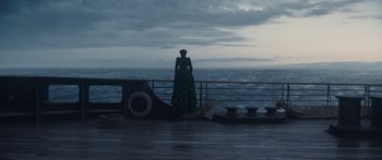 Movie still from “1899” (2022), created by Jantje Friese – A woman standing on a deck looking out at the ocean; Wide shot, High angle