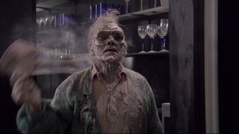 Movie still from “Scrooged” (1988), directed by Richard Donner – An old man with a face full of dirt; Close Up shot, Low angle