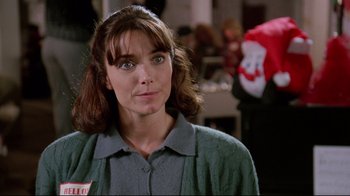 Movie still from “Scrooged” (1988), directed by Richard Donner – A person wearing a sweater; Close Up shot, Over the shoulder angle