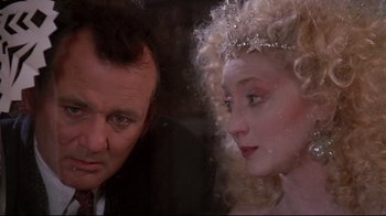 Movie still from “Scrooged” (1988), directed by Richard Donner – A man and a woman are looking at each other; Close Up shot, Over the shoulder angle