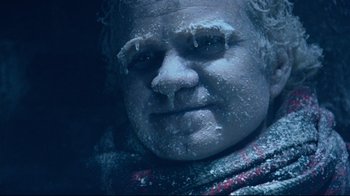 Movie still from “Scrooged” (1988), directed by Richard Donner – A person's face covered in snow; Close Up shot, High angle