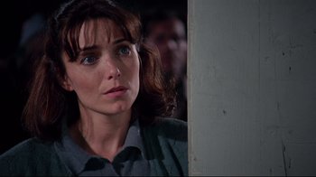 Movie still from “Scrooged” (1988), directed by Richard Donner – A person looking at the camera; Close Up shot, Over the shoulder angle