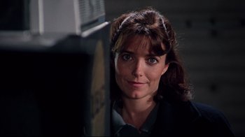 Movie still from “Scrooged” (1988), directed by Richard Donner – A person wearing a suit and tie; Close Up shot, Low angle