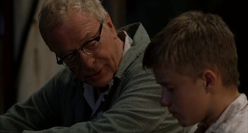 Movie still from “Secondhand Lions” (2003), directed by Tim McCanlies – An older man and a young boy sitting at a table; Close Up shot, Over the shoulder angle