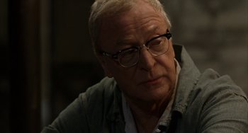 Movie still from “Secondhand Lions” (2003), directed by Tim McCanlies – An older man wearing glasses and a gray jacket; Close Up shot, Over the shoulder angle
