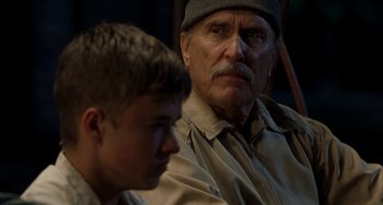 Movie still from “Secondhand Lions” (2003), directed by Tim McCanlies – An older man and a young boy sitting next to each other; Close Up shot, Over the shoulder angle