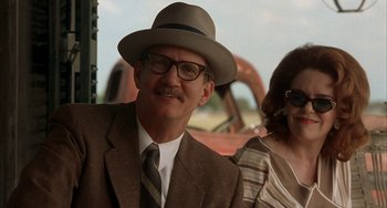 Movie still from “Secondhand Lions” (2003), directed by Tim McCanlies – A man wearing a hat and glasses next to a woman; Close Up shot, Low angle