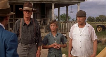 Movie still from “Secondhand Lions” (2003), directed by Tim McCanlies – A group of men standing next to each other; Medium shot, Low angle