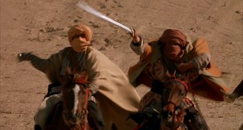 Movie still from “Secondhand Lions” (2003), directed by Tim McCanlies – Two men on horseback are holding a sword; Medium shot, Low angle