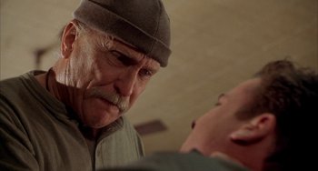 Movie still from “Secondhand Lions” (2003), directed by Tim McCanlies – An older man wearing a hat looking at a younger man; Close Up shot, Over the shoulder angle