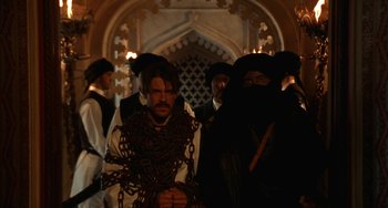 Movie still from “Secondhand Lions” (2003), directed by Tim McCanlies – A group of people standing next to each other in a room; Medium shot, Over the shoulder angle